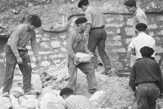 France 1963. Portuguese immigrant workers on a building site