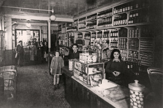 Mr. and Mrs. Messaoudi in their grocery store. 1950s, Levallois-Perret